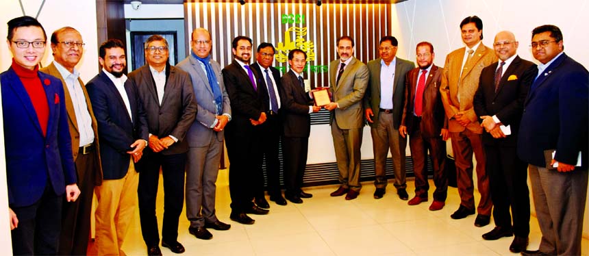 Dhaka Chamber of Commerce and Industry (DCCI) President Abul Kasem Khan, handing over a crest to the Ambassador of Vietnam Tran Van Khoa at DCCI office in the city on Thursday. Kamrul Islam, Senior Vice-President, Riyadh Hossain, Vice-President, Engr. Akb