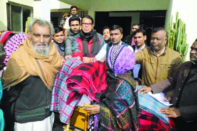 DINAJPUR (South): BRAC, Fulbari Unit distributing winter clothes among cold-ht people on Thursday.