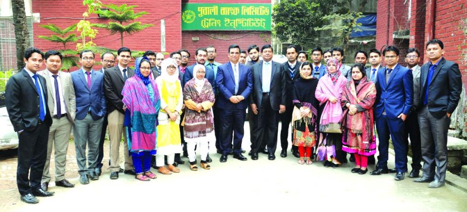 Md. Abdul Halim Chowdhury, Managing Director of Pubali Bank Limited, poses with the participants of a training course on 'Foundation Training for Senior Officers and Officers' at the banks Training Institute in the city recently. Niranjan Chandra Gope,