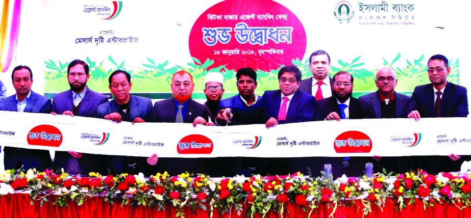 Arastoo Khan, Chairman of Islami Bank Bangladesh Limited, inaugurating an Agent Banking outlet at Jhitka Bazar of Harirampur Upazila in Manikganj on Thursday. Md. Shamsuzzaman, DMD, Md. Aminur Rahman, Senior Vice-President, and Shaikh Saidul Hasan, SAVP o