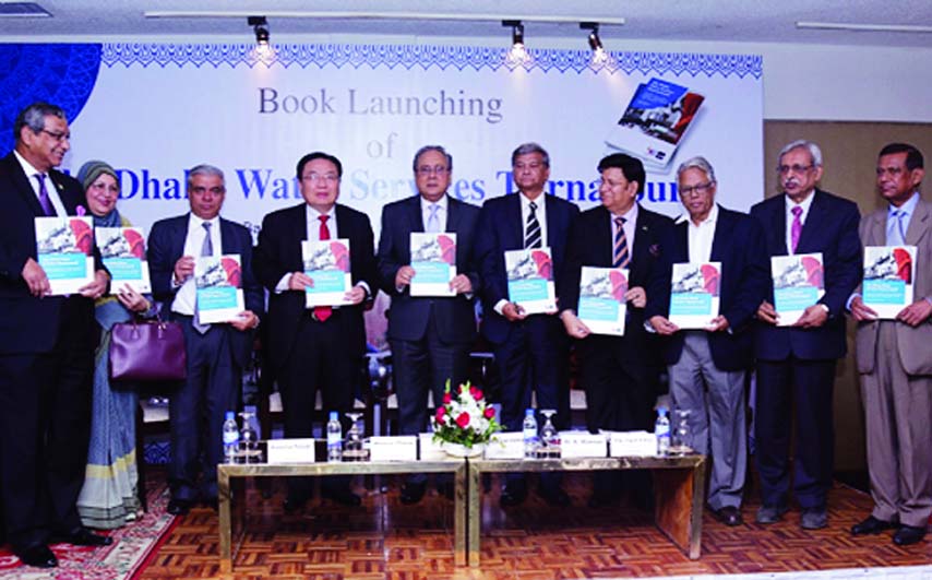 Forest and Environment Minister Anisul Islam Mahmud along with other distinguished persons holds the copies of a book titled 'The Dhaka Water Services Turnaround' at its cover unwrapping ceremony organised jointly by Asian Development Bank and Dhaka WAS