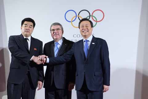 International Olympic Committee (IOC) President Thomas Bach (center) from Germany poses with North Korea's Olympic Committee President and Sports Minister Kim Il Guk (left) and South Korea's Sports Minister Do Jong-hwan (right) as they arrive for the No