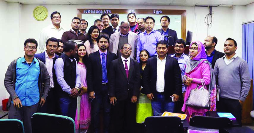 Teachers and students of Public Administration Department of Dhaka University pose for photograph with Adviser of former Caretaker Government Dr Akbar Ali Khan after a discussion titled "The Present Civil Service System in Banbgladesh"" recently."