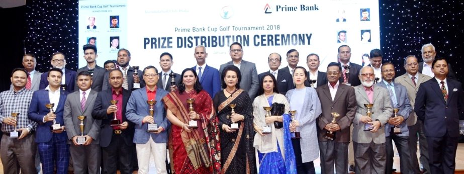 The winners of the Prime Bank Cup Golf tournament with the trophy and guests pose for photo in the prize giving ceremony at Kurmitola Golf Club recently.Major General AKM Abdur Rahman, Director General, Bangladesh Institute of International and Strategic