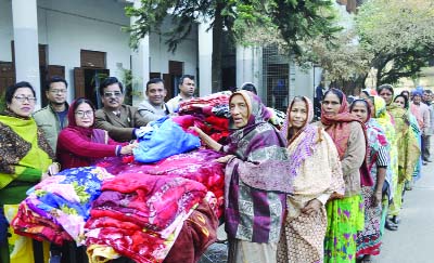 DINAJPUR: Prof Anjuman Akhter, Principal of Dinajpur Government Mahila College distributing blankets among the poor people at the college premises on Sunday.