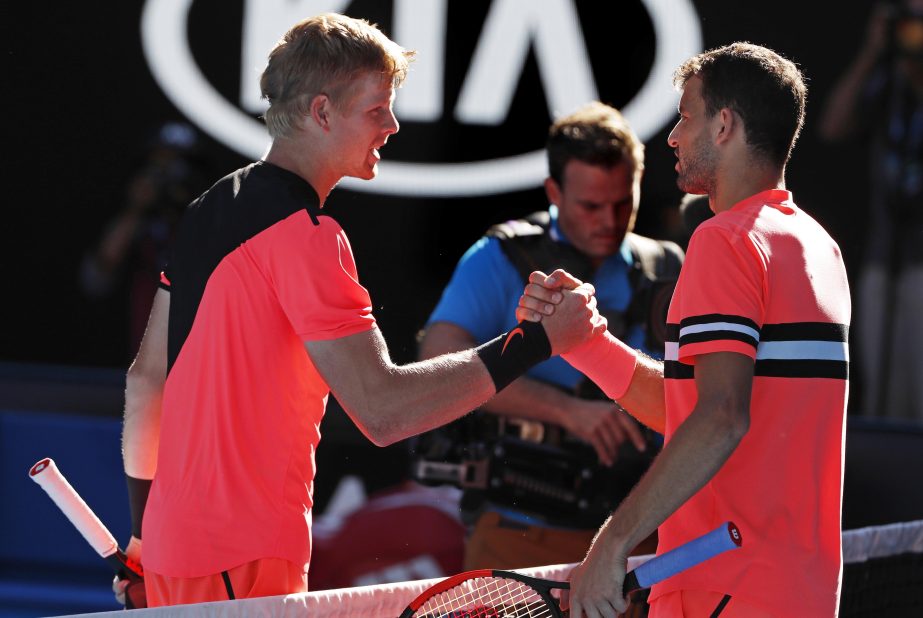 Britain's Kyle Edmund (left) shakes hands with Bulgaria's Grigor Dimitrov after winning their quarterfinal at the Australian Open tennis championships in Melbourne, Australia on Tuesday.