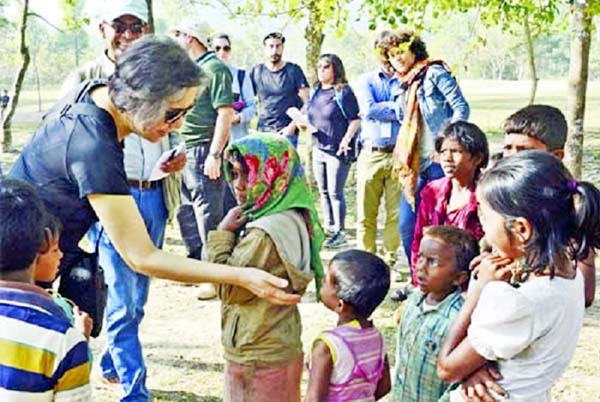Special envoy of UN Human Rights Commission Young Hy Lee talking to Rohingya children during her visit at Ukhiya camp on Sunday.