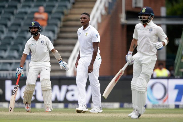 A half-century by Virat Kohli (right) and a patient defensive innings by Cheteshwar Pujara (left) helped India withstand a fast bowling barrage on the first day of the third and final Test against South Africa on Wednesday.