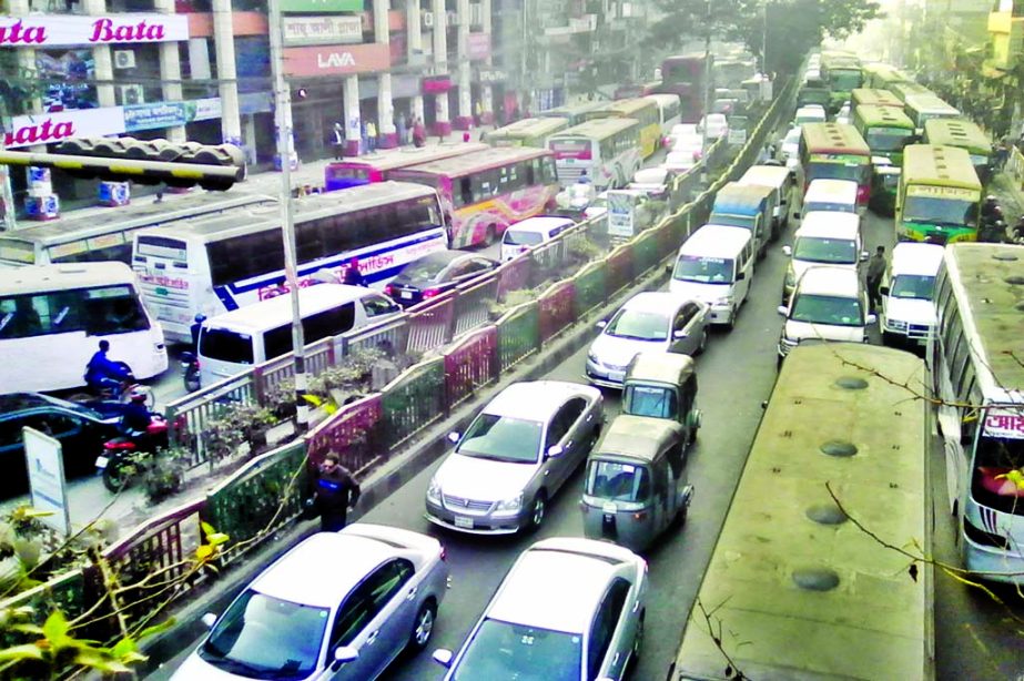 Hundreds of vehicles got stuck in long queues of traffic gridlock from Mirpur 10 to Pallabi for several hours, causing sufferings to commuters as road becomes narrow for blocking from both sides for metro rail working.