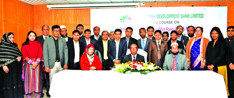 Manjur Ahmed, Managing Director of Bangladesh Development Bank Limited, poses with the participants of a five day long training course on "SME Financing and Sector-Wise Agriculture and Rural Credit" at the banks Training Institute in the city on Sunday.