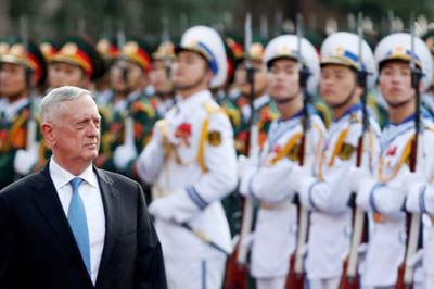 US Secretary of Defense Jim Mattis reviews the guard of honour during a welcoming ceremony in Hanoi on Thursday..
