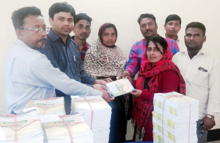 Mohammad Shahjahan, Mayor, Ramgarh Pourashava distributing school diaries among students of 12 primary schools at the Pourashava area on Tuesday.