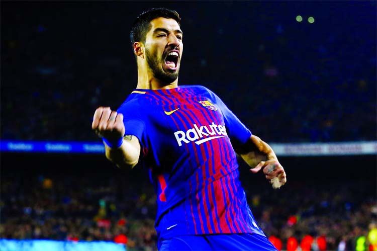 FC Barcelona's Luis Suarez celebrates after scoring during the Spanish Copa del Rey, quarter final, second leg, soccer match between FC Barcelona and Espanyol at the Camp Nou stadium in Barcelona, Spain on Thursday.