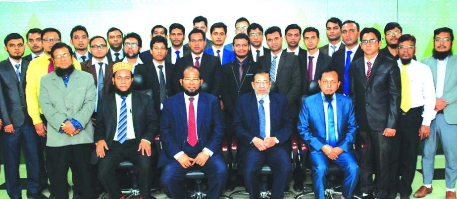 Md. Habibur Rahman, Managing Director of Al-Arafah Islami Bank Limited, poses with the participants of a 2 week long foundation course on 'Banking for Executive Officers' at the banks Training and Research Institute in the city on Thursday. Md. Nurul Is