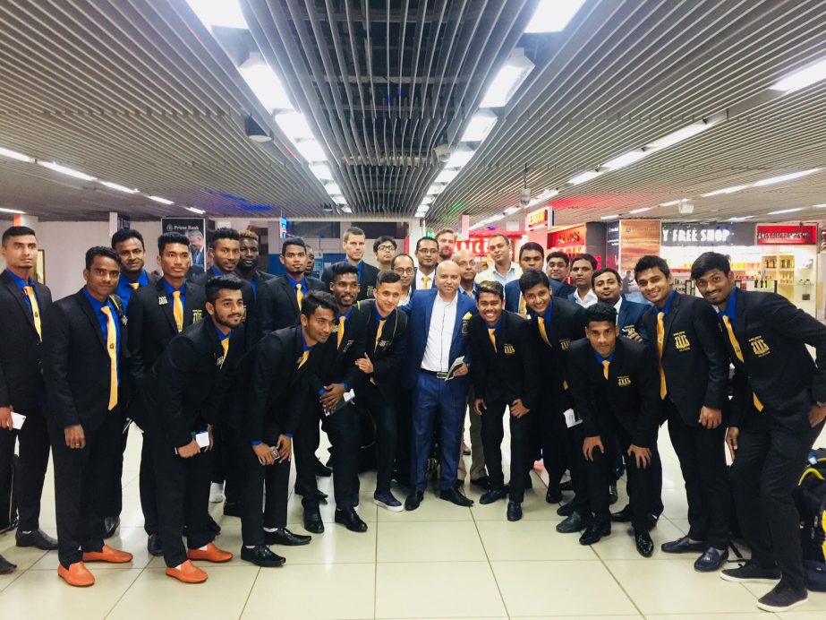 Members of Saif Sporting Club Limited pose for a photo session at the Shahjalal International Airport on Saturday before leaving for Maldives to take part in the AFC qualifiers against TC Sports Club of Maldives.