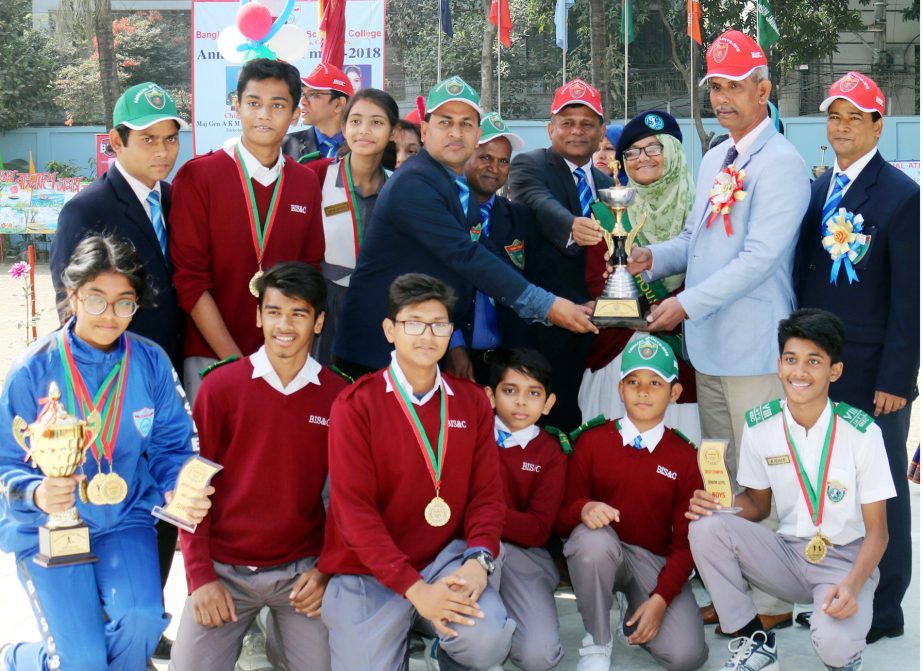 Director General of BIISS Major General AKM Abdur Rahman with the winners of the Annual Sports Competition of Bangladesh International School & College pose for photograph at the college premises on Saturday.