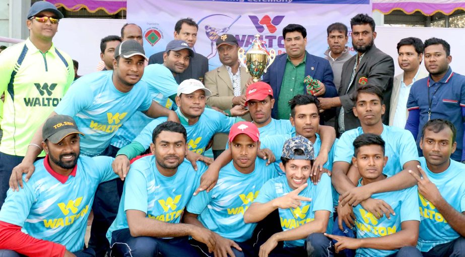 Players of Bangladesh Police, who became champion of the Walton's 5th National Baseball Championship pose for photo with the trophy and guest at Paltan ground on Monday.