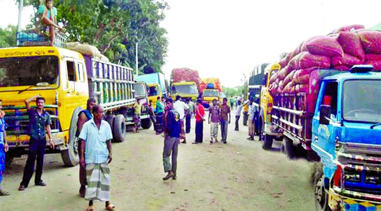 Several goods-laden trucks of Bangladesh and India at Petrapole and Benapole land ports lying idle for the last four days due to corpus/documents and goods clearance problems. This photo was taken from Benapole port on Monday.