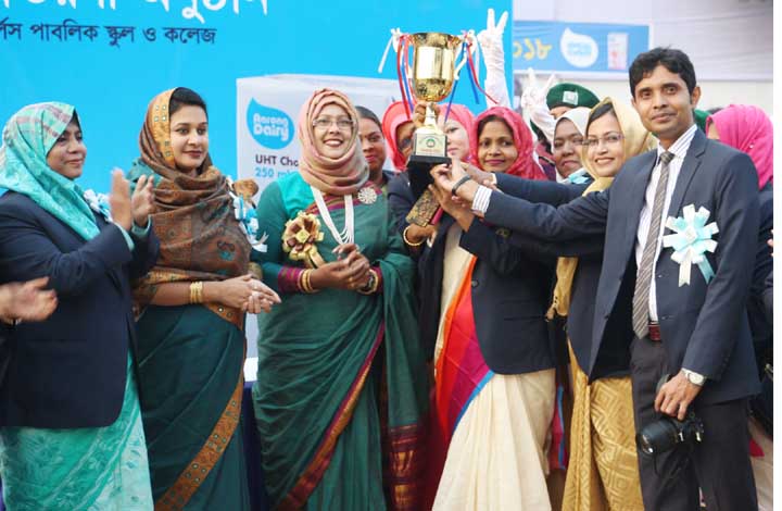 Members of Jahanara Imam House, the champions of the Inter-House Annual Sports Competition of Dhaka Cantonment Girls Public School & College with the teachers of college pose for photograph at the college premises in Dhaka Cantonment on Wednesday.