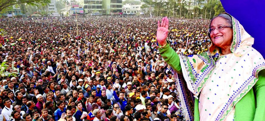 Prime Minister Sheikh Hasina waiving the mammoth public meeting at the Sylhet Alia Madrasa ground on Tuesday. BSS photo