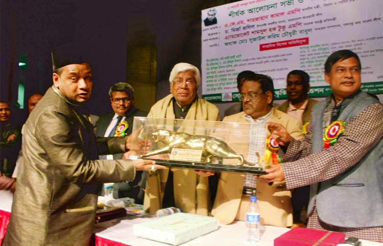 Minister for Civil Aviation and Tourism AKM Shahjahan Kamal handing over crest to eminent astrologer Lito Dewan Chisti at a function at Public Library Auditorium in the city recently.