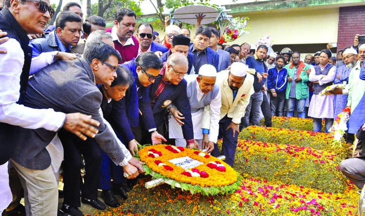 Dhaka South City Corporation (DSCC) Mayor Mohammad Sayeed Khokon placing wreaths at the grave of seven murder at Azimpur Graveyard yesterday.