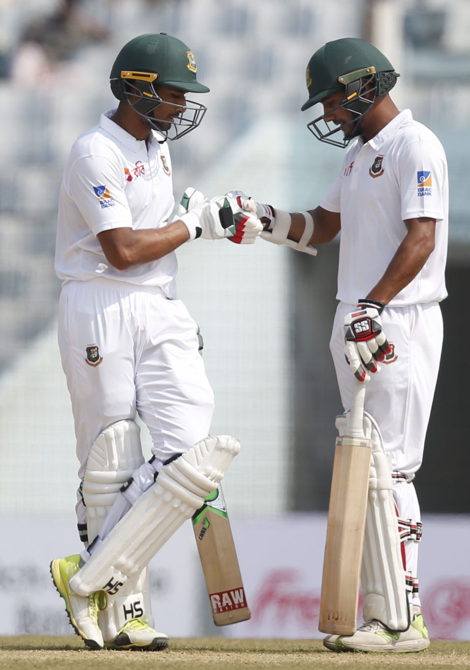 Sunzamul Islam (right) and captain Mahmudullah celebrate a boundary shot during the second day of their first Test cricket match against Sri Lanka at Zahur Ahmed Chowdhury Stadium in Chittagong on Thursday.