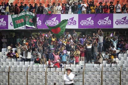 Bangladeshi spectators cheer their team during the second day of the first Test cricket match against Sri Lanka at Zahur Ahmed Chowdhury Stadium in Chittagong on Thursday.