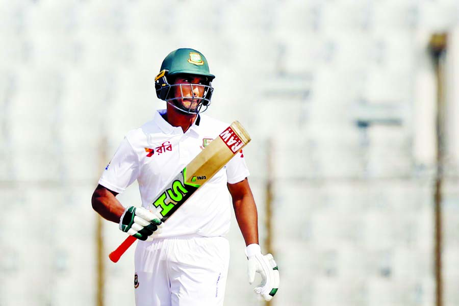 Bangladesh's captain Mahmudullah acknowledges the crowd after scoring fifty runs during the second day of the first Test cricket match against Sri Lanka, at the Zahur Ahmed Chowdhury Stadium in Chittagong on Thursday.