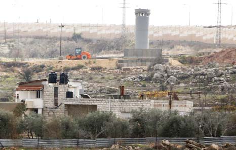 The house of the Palestinian Jumaa family, which became encircled by Israel's controversial separation barrier, north of Ramallah.