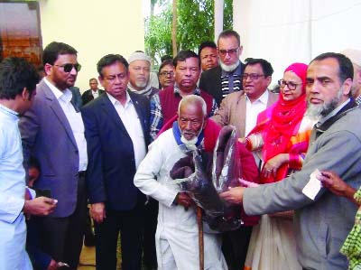 MOULVIBAZAR: Leaders of Greater Sylhet Development and Welfare Council, UK distributing blankets among the cold- hit people at Moulvibazar on Wednesday. Sayeda Sayra Mohsin MP was present as Chief Guest.