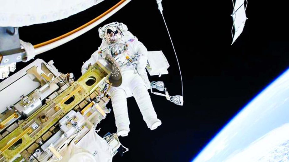 An astronaut goes on a spacewalk outside the International Space Station, where he may soon be joined by tourists.