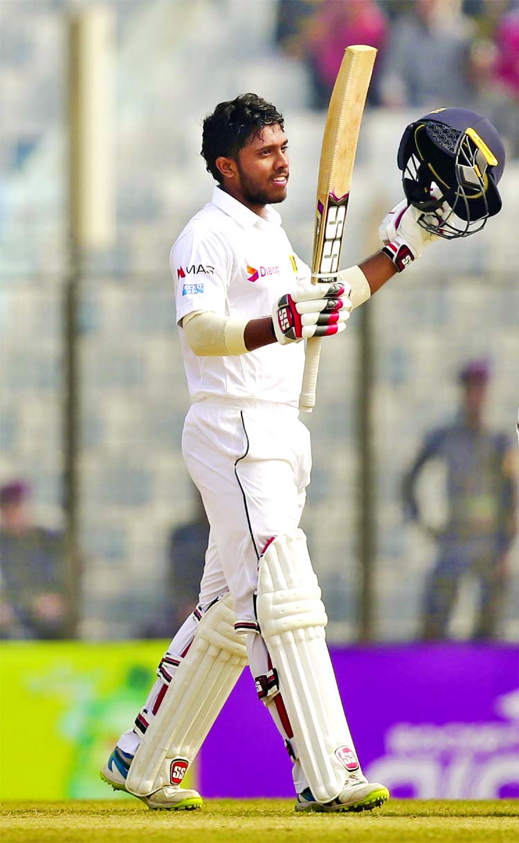 Sri Lanka's Kusal Mendis acknowledges the crowd after scoring hundred runs during the third of their first Test cricket match against Bangladesh in Chittagong on Friday.