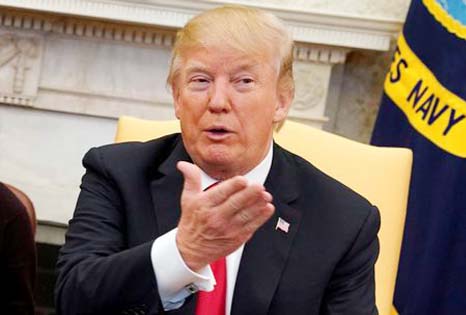 U.S. President Donald Trump talks to the media during his meeting with North Korean defectors in the Oval Office of the White House in Washington.