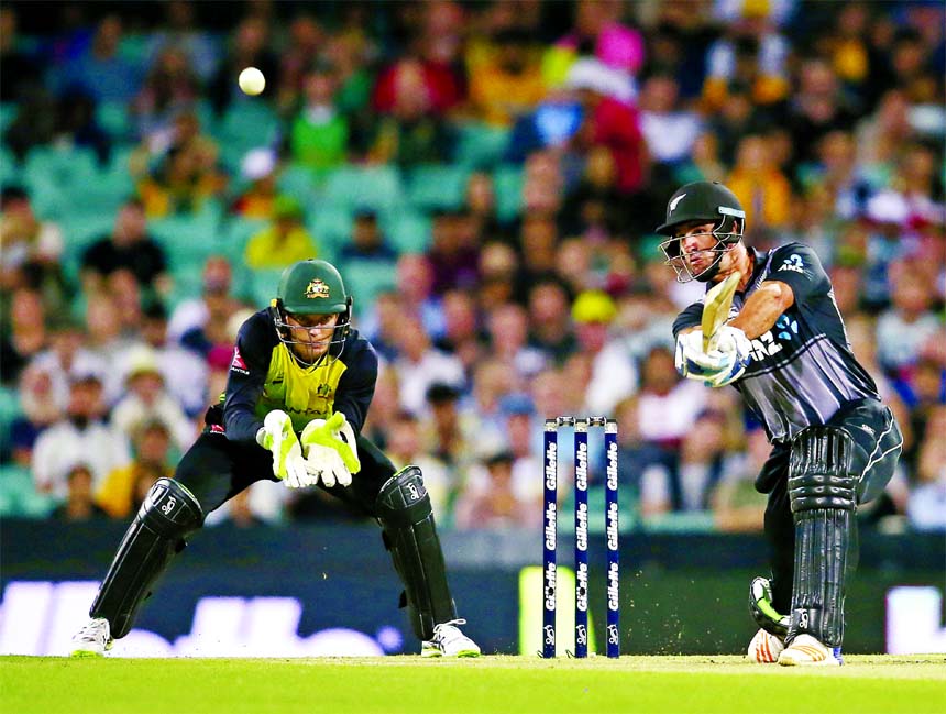 New Zealand's Colin De Grandhomme (right) hits a six of Australia's Adam Zampa during their Twenty20 cricket match in Sydney on Saturday,