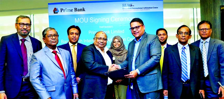 Muhammad A (Rumee) Ali, CEO of Bangladesh International Arbitration Centre and Rahel Ahmed, Managing Director of Prime Bank Limited, exchanging a MoU signing documents at the banks head office in the city recently. Md. Golam Rabbani, Syed Faridul Islam, D