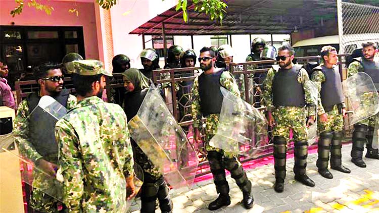 Soldiers in riot gear surrounded the parliament building in Male on Sunday.