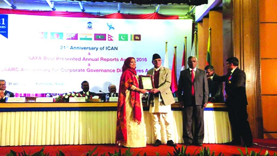 Mohammodi Khanam, CEO of Prime Insurance Company Limited, recieving the "Best Presented Annual Reports 2016" award from Shankar Prasad Adhikari, Finance Secretary of Nepal Government in insurance category among the SAARC countries by South Asian Federat
