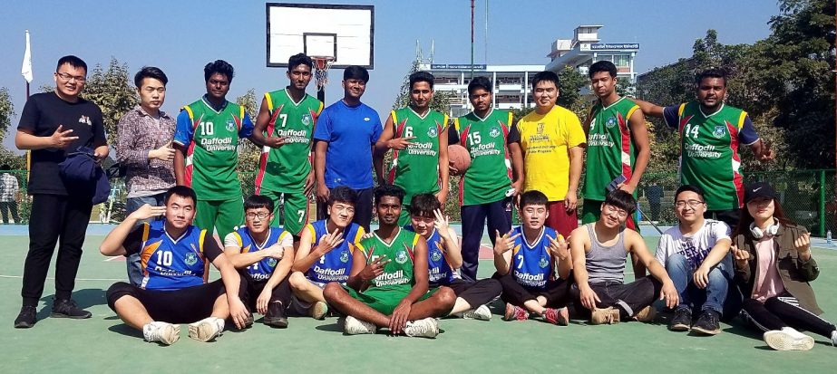 Players of SIAS International University China and Daffodil International University (DIU) pose for a photograph at 'Bangladesh-China Friendship Basketball Match' held at DIU permanent campus at Ashulia on Saturday.