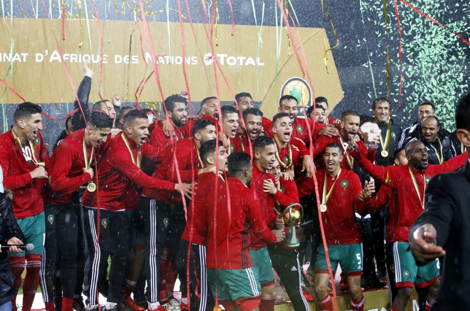 Morocco's players celebrate on the podium after defeating Nigeria in the final of the CHAN (African Nations Championship) soccer tournament at the Mohammed V stadium in Casablanca, Morocco on Sunday.