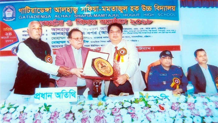 Founder President of Gatiadanga Alhaj Safia-Mamtazul Hoque High School of Satkania Upazila in South Chittagong and noted entrepreneur Alhaj Abul Bashar Abu seen handing over crest to Chairman of MRK Group Alhaj M Abdul Awal at a reception accorded