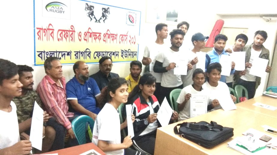 The participants of the 'rugby referees and coaches training programme' with the guests and officials of Bangladesh Rugby Union (BRU) pose for photograph at the office room of BRU on Tuesday.