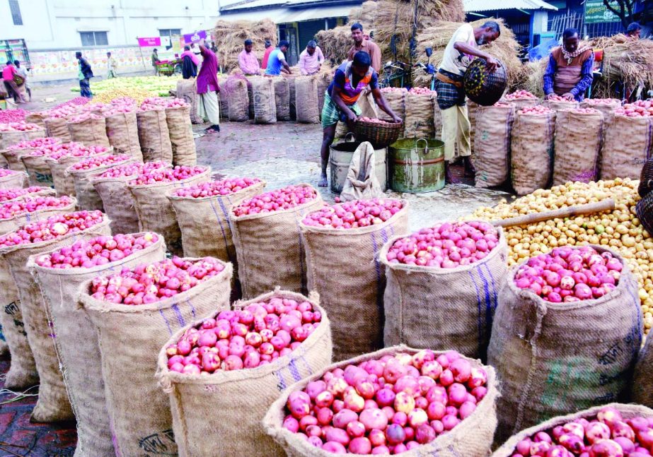 BOGRA: Potato traders passing busy time in Bogra as the district have achieved bumper production of the product. This snap was taken from Mahasthan Haat yesterday.