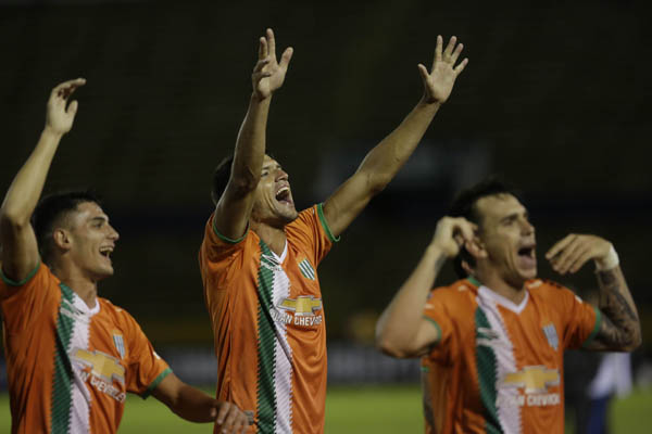 Players of Argentina's Banfield celebrate their classification to the next round of the Copa Libertadores soccer tournament, after a game with Ecuador's Independiente del Valle in Quito, Ecuador on Tuesday.