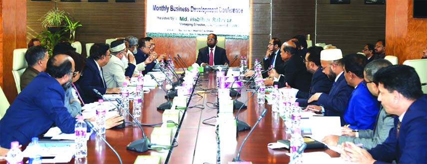 Md. Habibur Rahman, Managing Director of Al-Arafah Islami Bank Limited, presiding over its 'Monthly Business Review Meeting' at its head office in the city on Wednesday. Kazi Towhidul Alam, Md. Fazlul Karim, SM Jaffar and Mohammed Zubair Wafa, DMDs of t