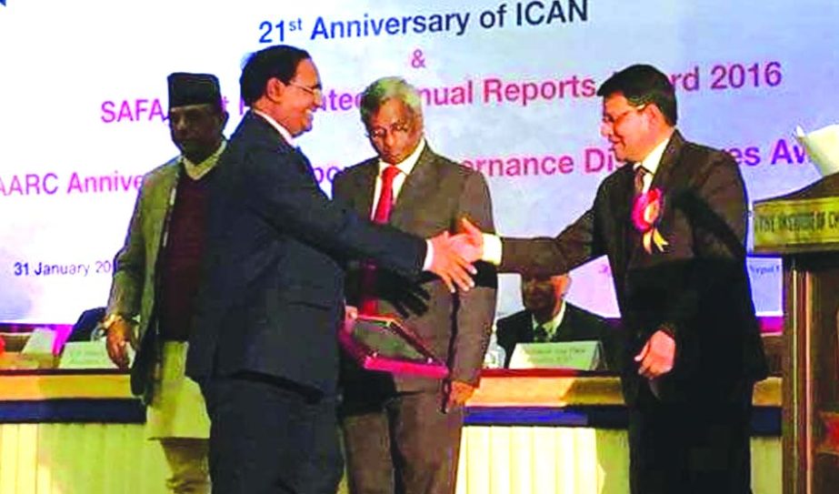 Md. Ismail Hossain, Deputy Managing Director of Janata Bank Limited, receiving the ''South Asian Federation of Accountants (SAFA)''award under state owned commercial bank category from Tanaka Moni Dangule, Auditor General of Nepal at a hotel of Kathmu