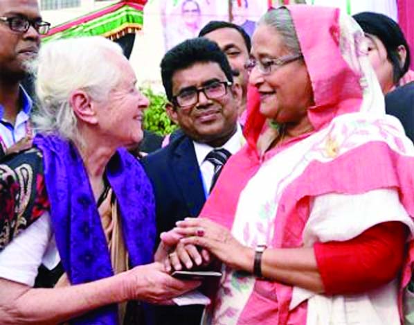 BARISAL: Prime Minister Sheikh Hasina handing over the passport with a 15-year multiple Bangladeshi visa to Lucy just before the public meeting at Bangabandhu Udyan in the divisional city on Thursday afternoon.