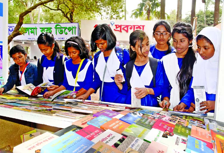 Children crowding book stalls at Shishu Prohor, sorting out publication of their choice at Amar Ekushey Boi Mela at Bangla Academy on Friday.