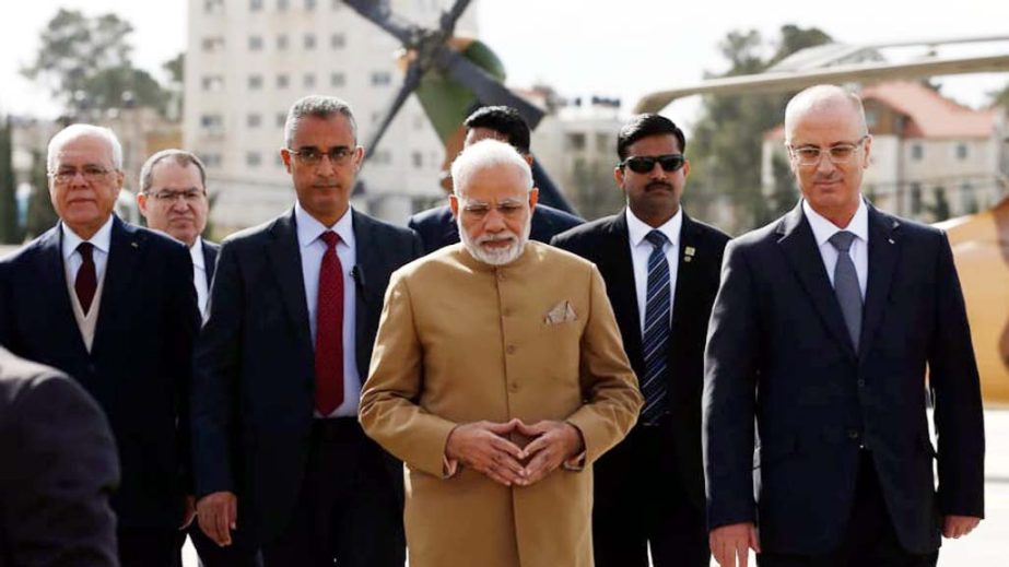 Indian Prime Minister Narendra Modi walks with Palestinian prime minister Rami Hamdallah upon his arrival in the West Bank city of Ramallah on Saturday.