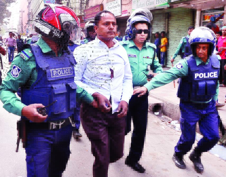 Law enforcers nabbed a BNP activist from the demonstration brought out in the city on Saturday in protest against verdict on BNP Chairperson Begum Khaleda Zia.